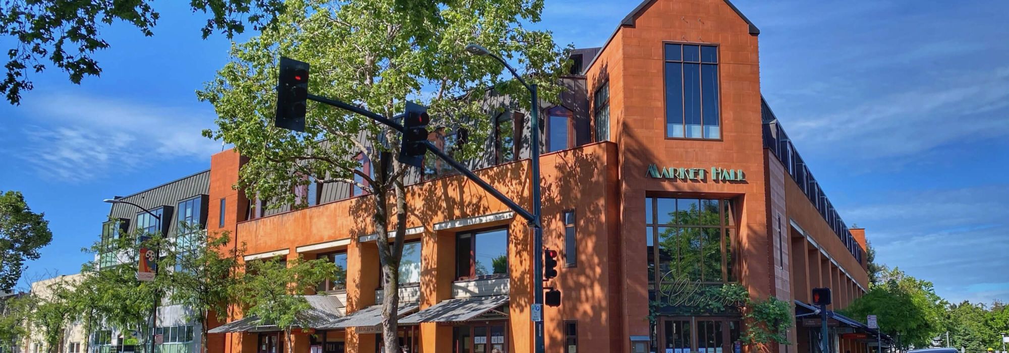 Exterior of Rockridge Market Hall with the MARKET HALL sign above the entrance